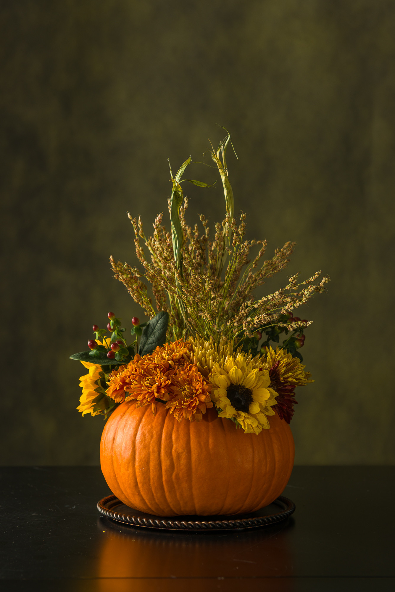 Fall pumpkin floral centerpiece for Thanksgiving.