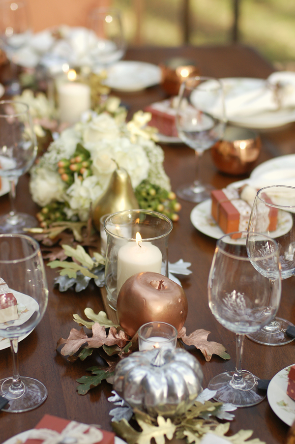 Elegant thanksgiving centerpiece made from spray painted fruits and leaves.