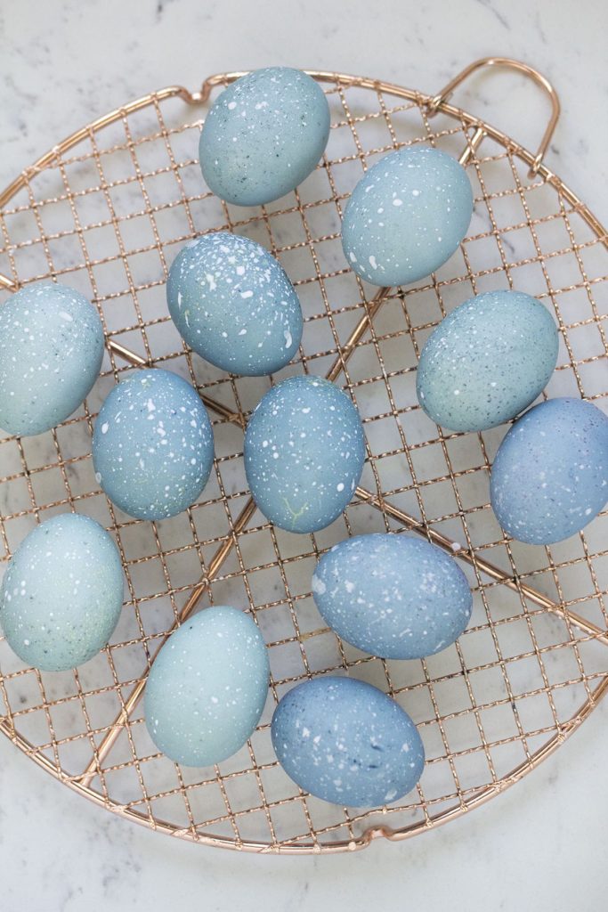 Tutorial for dyeing easter eggs with blueberries to make these beautiful blue, speckled eggs.