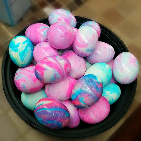 shaving cream dyed easter eggs in bright pastel colors and a marbleized pattern.