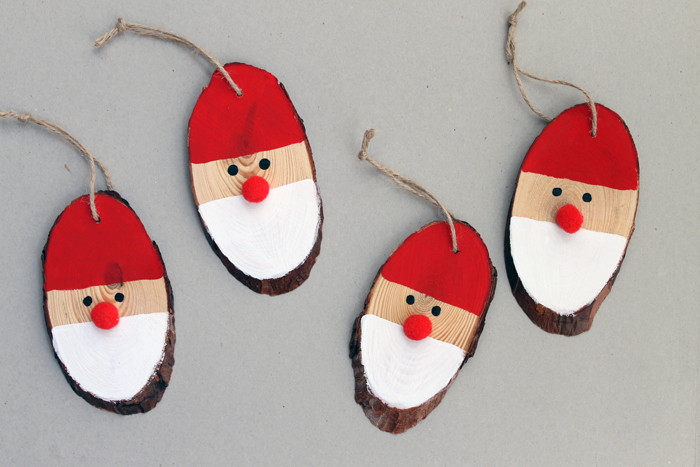 Wood slice Santa Claus Christmas ornaments.